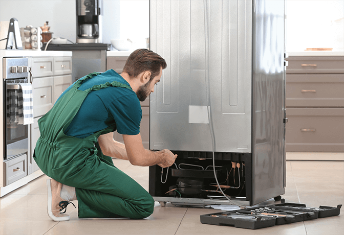Certified Samsung refrigerator technician performing Digital Inverter repair in Dubai home by One Click Dubai